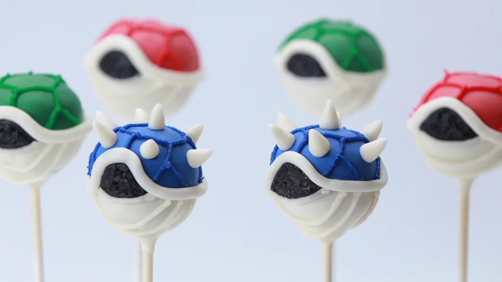 Cake Pops de cascos do Koopa, os famosos cascos de tartaruga coloridos